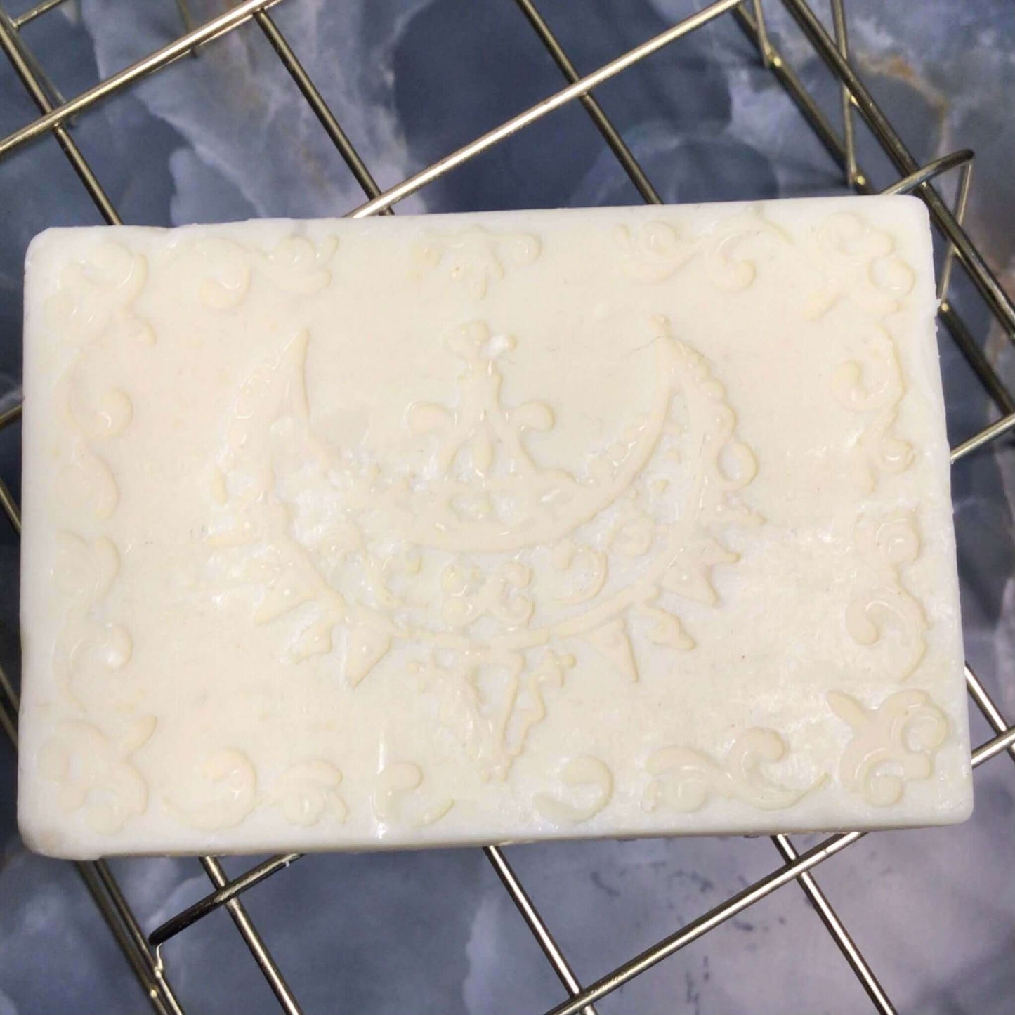 handmade organic creamy bar soaps with intricate molded patterns such as heart butterfly and dolphin made of pure ingredients