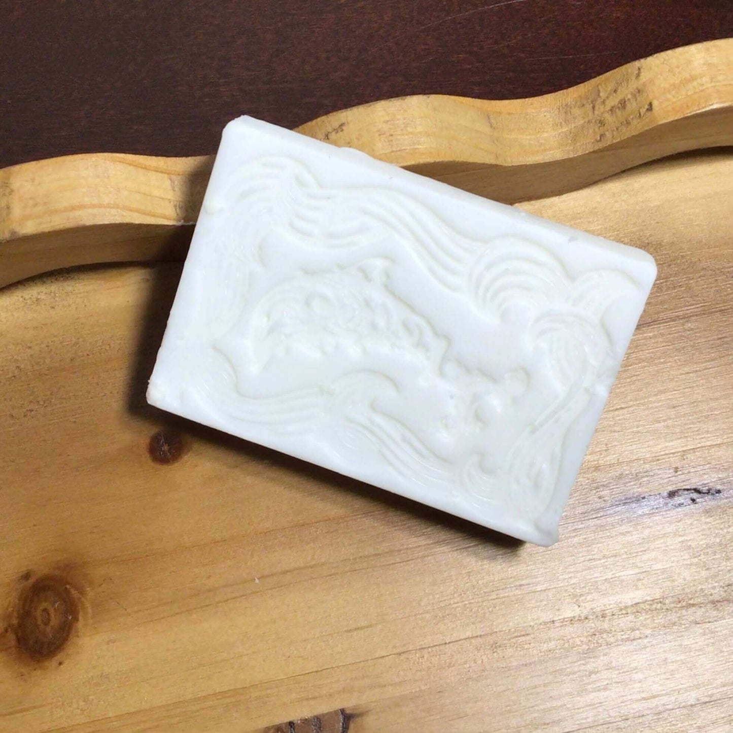 handmade organic creamy bar soaps with intricate molded patterns such as heart butterfly and dolphin made of pure ingredients