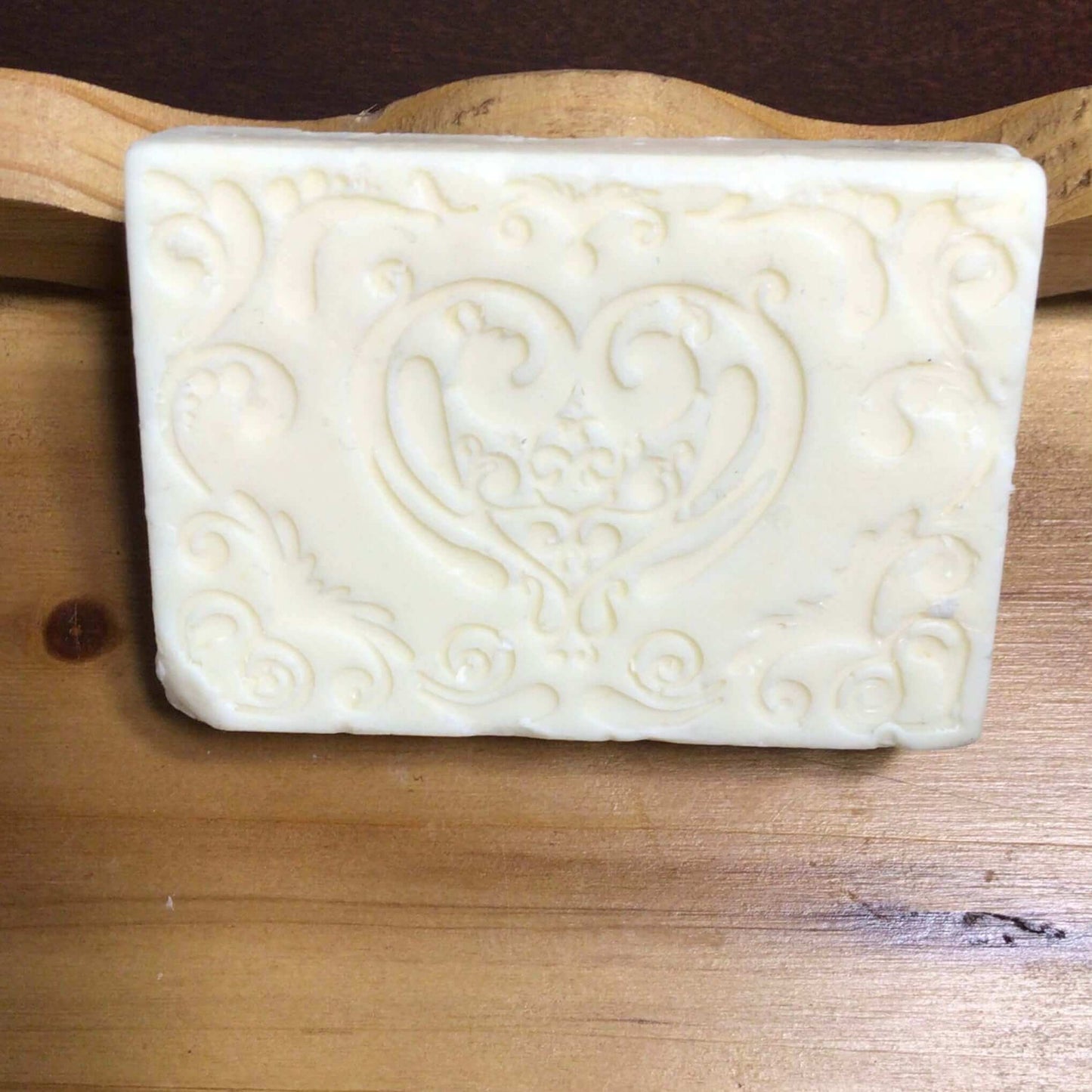 handmade organic creamy bar soaps with intricate molded patterns such as heart butterfly and dolphin made of pure ingredients
