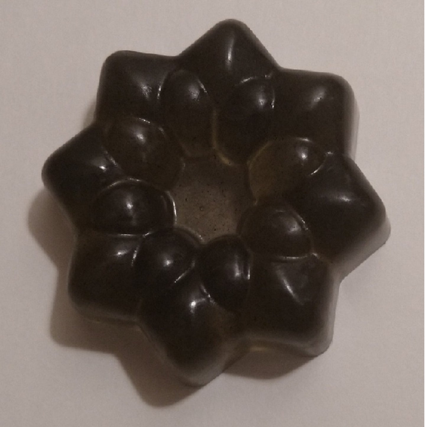 activated charcoal bar with the ribbed ring shape and open center