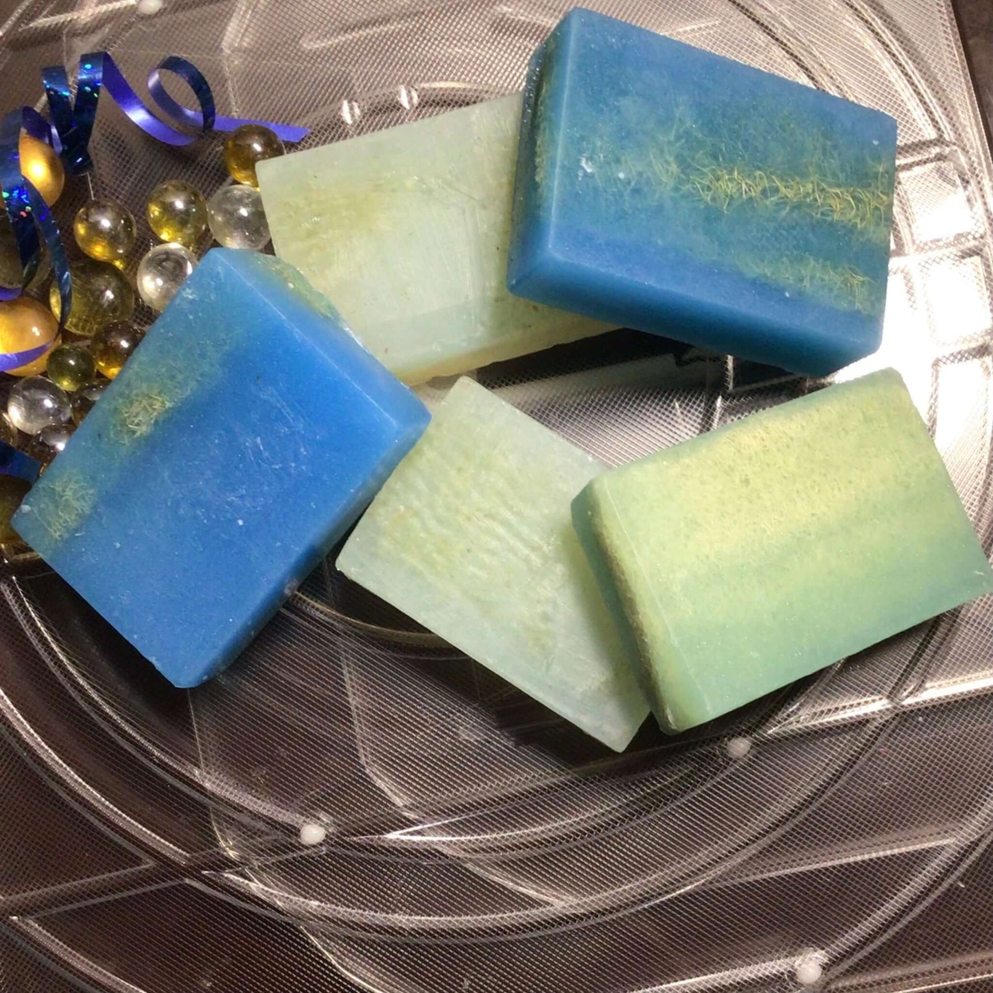 Handmade Organic Exfoliating Glycerin Soap with embedded loofah fruit or exfoliating cloth to gently smooth and refine skin