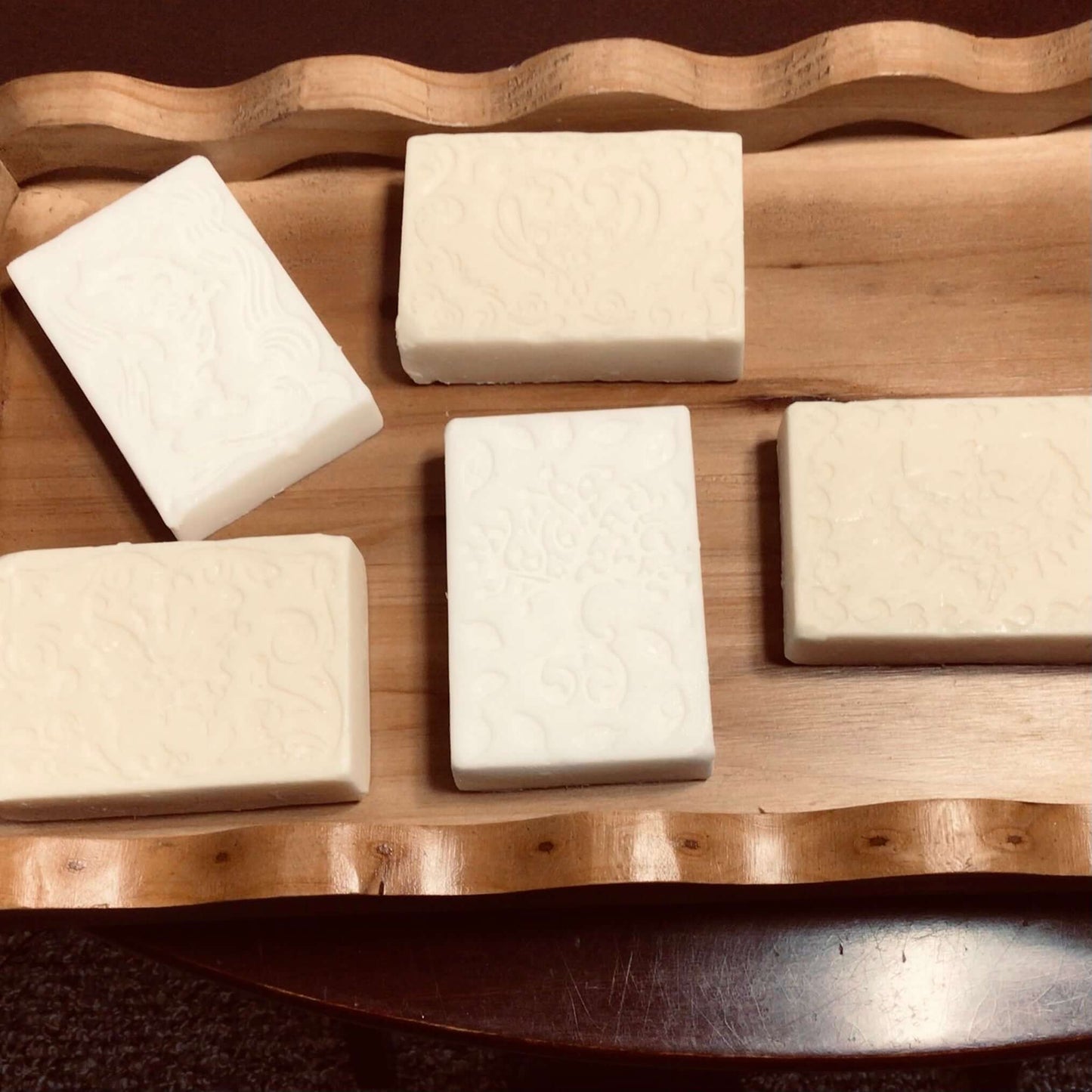 handmade organic creamy bar soaps with intricate molded patterns such as heart butterfly and dolphin made of pure ingredients